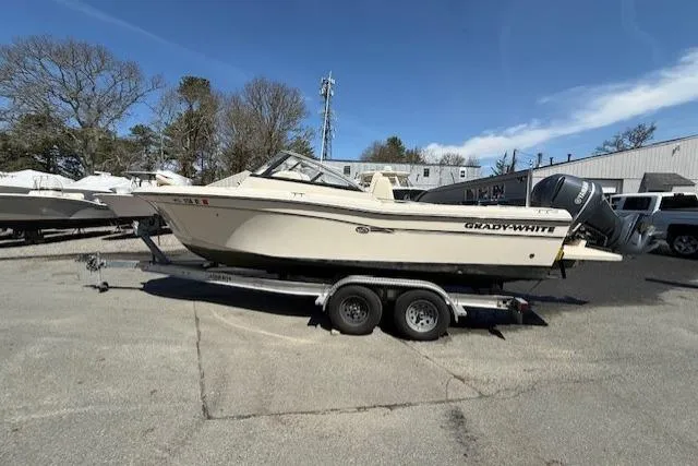 Slide: The Image of 2015 Grady-White Freedom 225 boat on trailer in outdoor setting. - 4