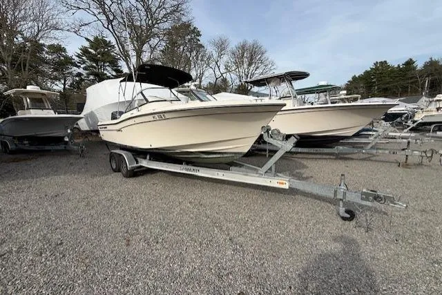 Slide: The Image of 2015 Grady-White Freedom 225 boat on trailer in outdoor storage area. - 45