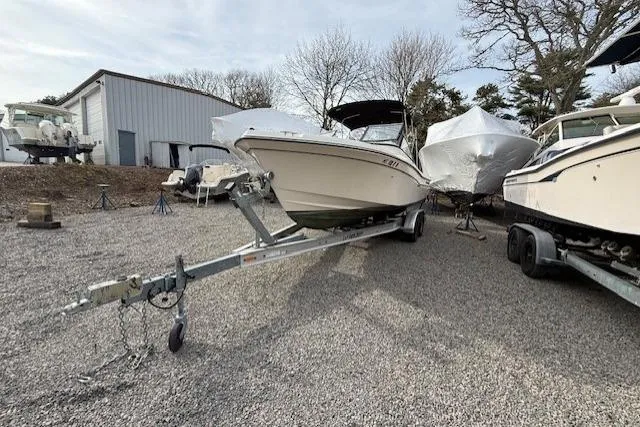 Slide: The Image of 2015 Grady-White Freedom 225 boat on trailer in storage yard. - 46