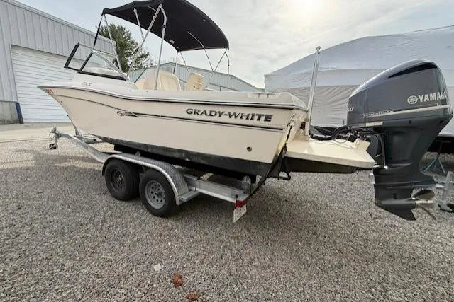 Slide: The Image of 2015 Grady-White Freedom 225 boat on trailer with Yamaha outboard motor. - 48