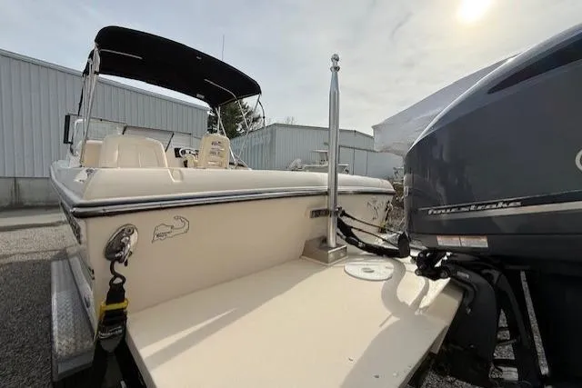 Slide: The Image of 2015 Grady-White Freedom 225 boat with outboard motor, parked outdoors. - 49