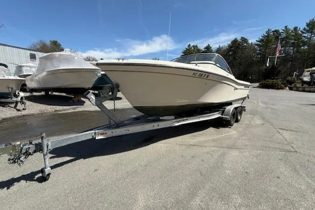 Slide: The Image of 2015 Grady-White Freedom 225 boat on trailer in outdoor setting. - 5