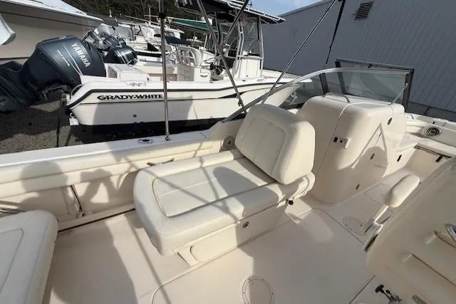 Slide: The Image of 2015 Grady-White Freedom 225 boat interior with seating and Yamaha outboard motor. - 9
