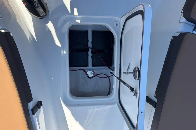 Slide: The Image of Open storage compartment on 2026 Sea Pro 202 Center Console boat. - 10