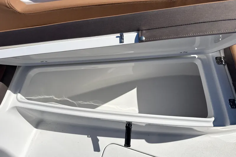 Slide: The Image of Open storage compartment in 2026 Sea Pro 202 Center Console boat. - 11