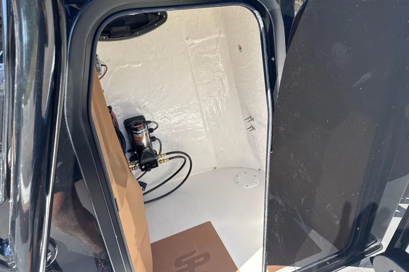 Slide: The Image of Interior view of 2026 Sea Pro 202 Center Console boat compartment. - 14