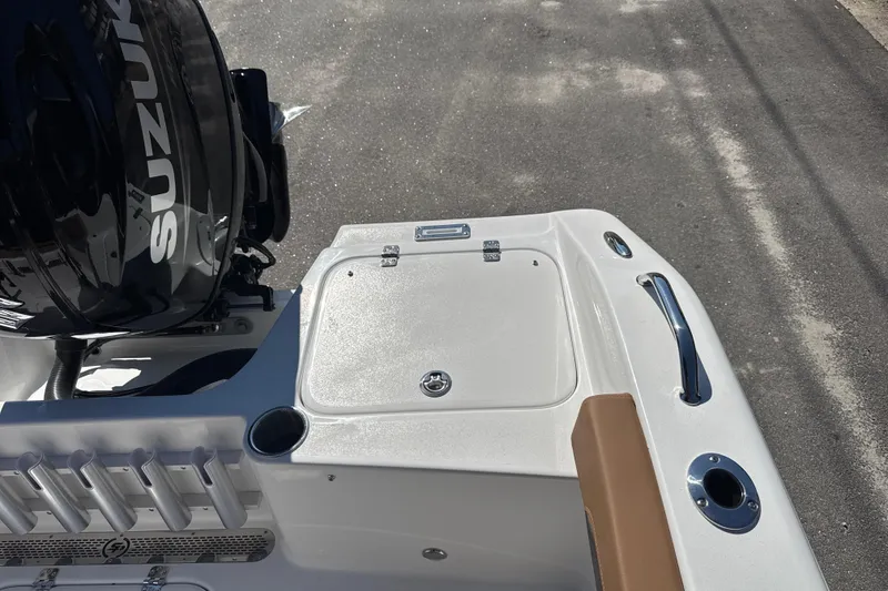 Slide: The Image of 2026 Sea Pro 202 Center Console boat with Suzuki engine, featuring storage and rod holders. - 18