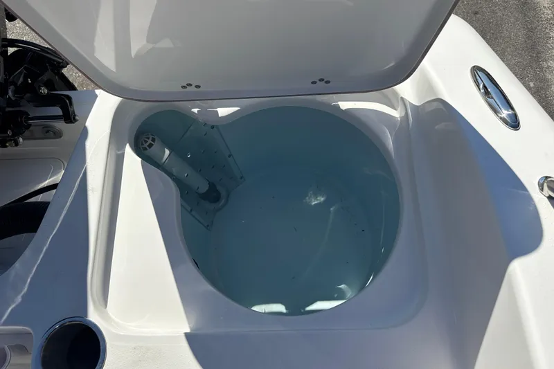 Slide: The Image of Open livewell on 2026 Sea Pro 202 Center Console boat, showcasing interior design. - 19