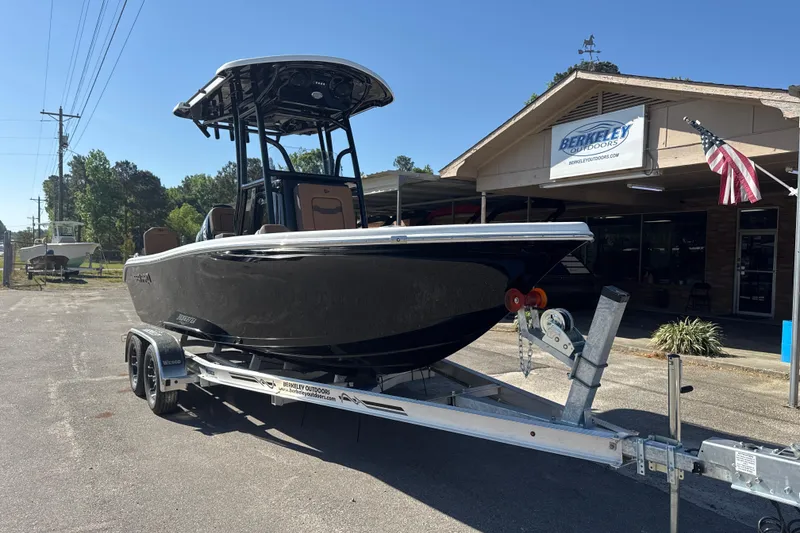 Slide: The Image of 2026 Sea Pro 202 Center Console boat on trailer outside Berkeley Outdoors. - 2