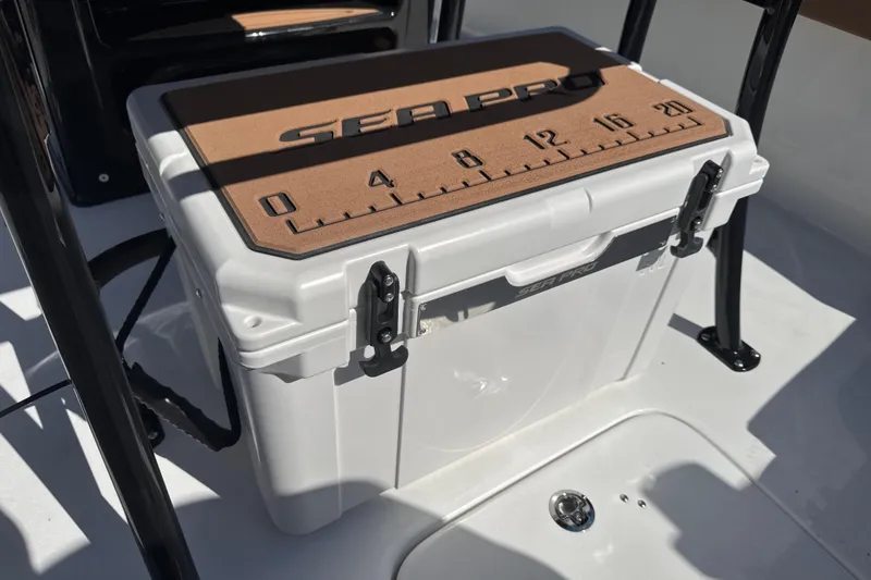 Slide: The Image of 2026 Sea Pro 202 Center Console cooler with measuring scale on lid. - 20