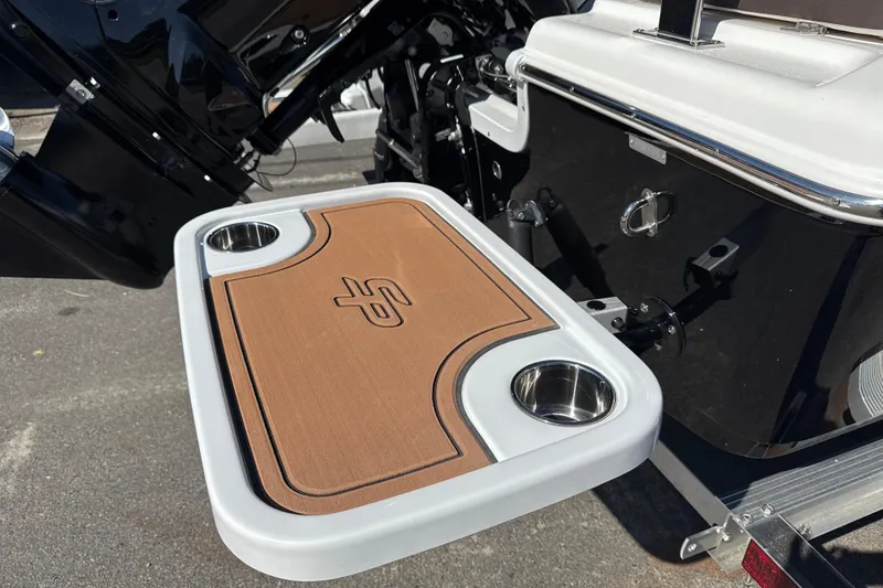 Slide: The Image of 2026 Sea Pro 202 Center Console boat with a foldable table and cup holders. - 22