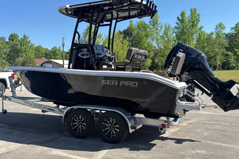 Slide: The Image of 2026 Sea Pro 202 Center Console boat on trailer, parked outdoors. - 5