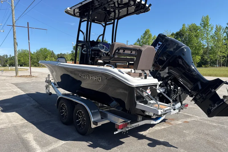 Slide: The Image of 2026 Sea Pro 202 Center Console boat on trailer, parked outdoors. - 6