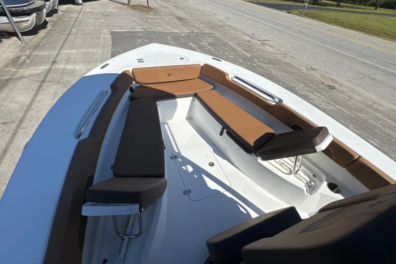 Slide: The Image of 2026 Sea Pro 202 Center Console boat with brown seating and spacious deck. - 7