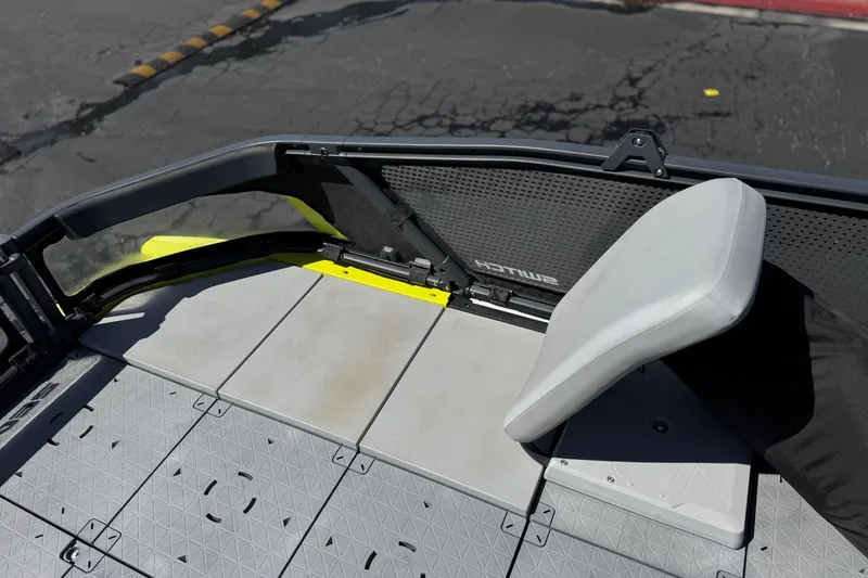 Slide: The Image of 2022 Sea-Doo Switch Sport 21 deck with modular seating and textured flooring. - 12