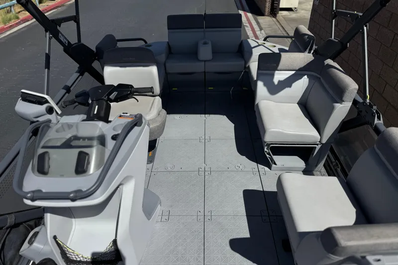 Slide: The Image of 2022 Sea-Doo Switch Sport 21 interior with spacious seating and modern controls. - 13