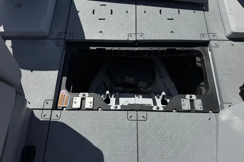 Slide: The Image of Open storage compartment on 2022 Sea-Doo Switch Sport 21 boat deck. - 17