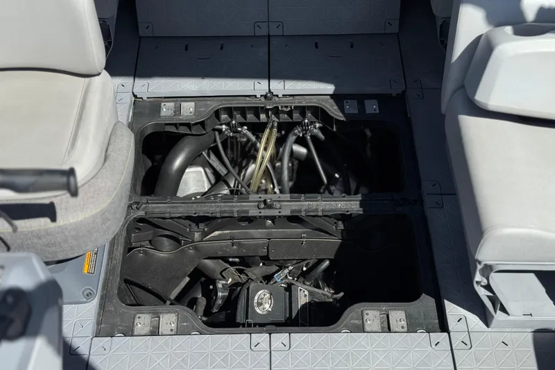 Slide: The Image of Engine compartment of 2022 Sea-Doo Switch Sport 21, showcasing internal components and seating layout. - 18
