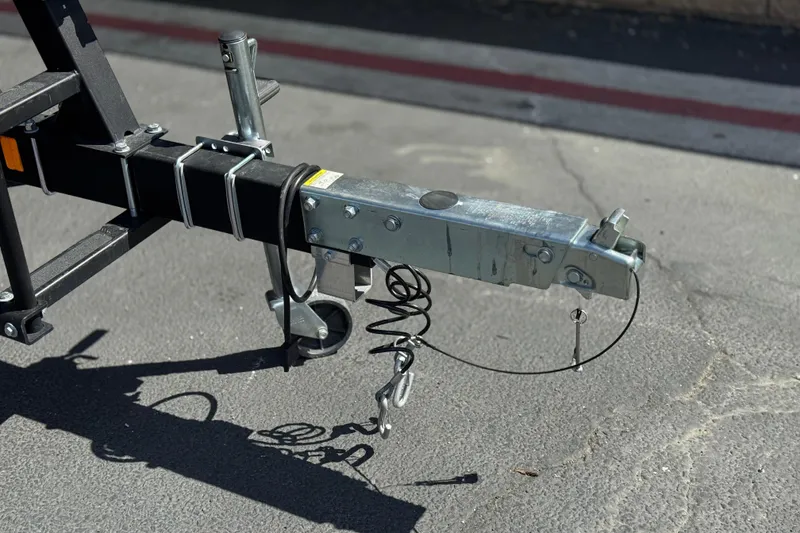 Slide: The Image of Trailer hitch of a 2022 Sea-Doo Switch Sport 21 on pavement. - 26