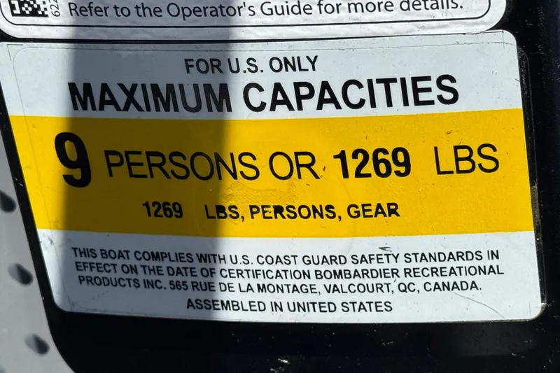 Slide: The Image of 2022 Sea-Doo Switch Sport 21 capacity label: 9 persons or 1269 lbs. - 27