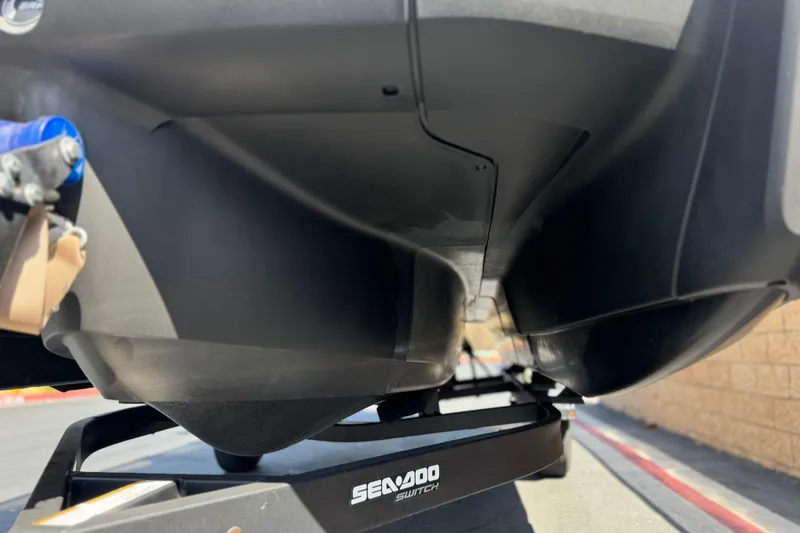Slide: The Image of Underneath view of a 2022 Sea-Doo Switch Sport 21 on a trailer. - 4