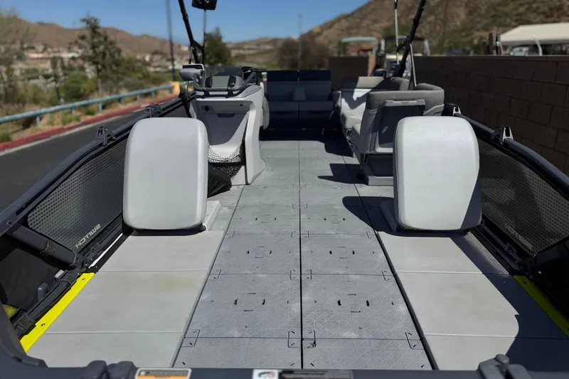 Slide: The Image of 2022 Sea-Doo Switch Sport 21 interior with modular seating and spacious deck. - 9