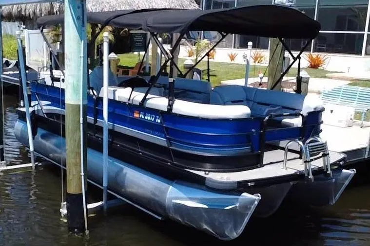 The Image of 2022 Godfrey Sweetwater 2286FS pontoon boat at dock. - 0