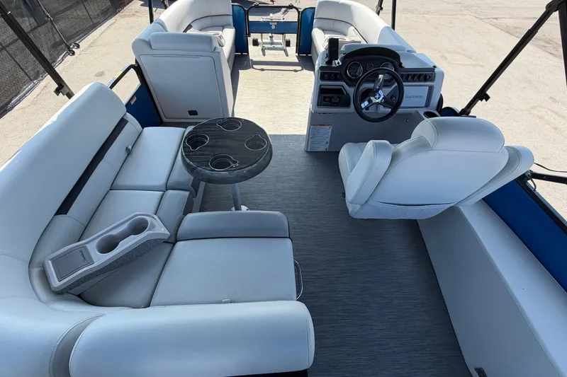 Slide: The Image of Interior of 2022 Godfrey Sweetwater 2286FS pontoon boat with plush seating and steering console. - 68