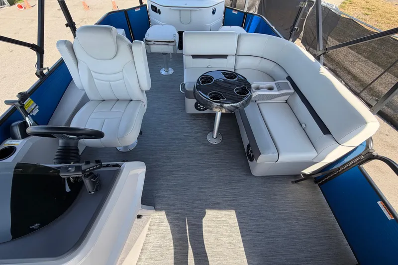Slide: The Image of Interior of 2022 Godfrey Sweetwater 2286FS pontoon boat with white seating and table. - 23