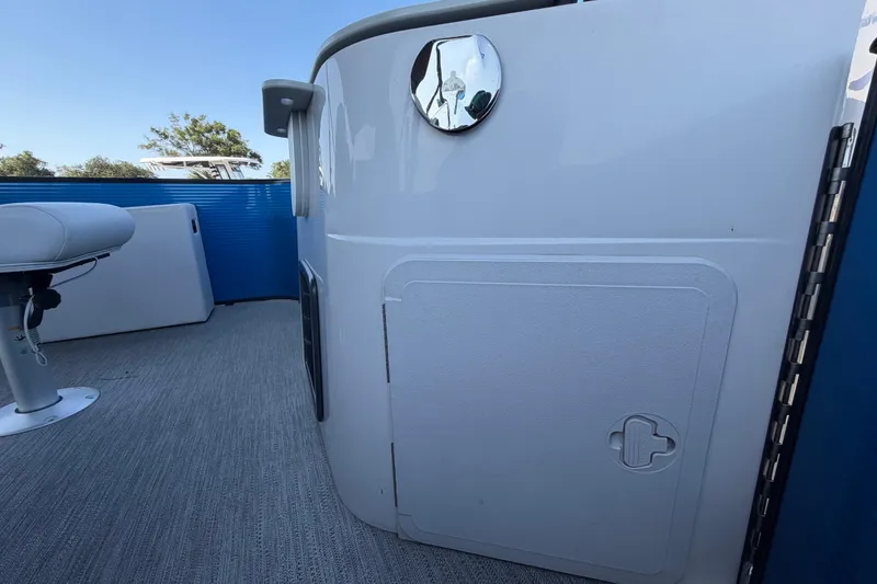 Slide: The Image of 2022 Godfrey Sweetwater 2286FS boat interior with seating and storage compartment. - 58