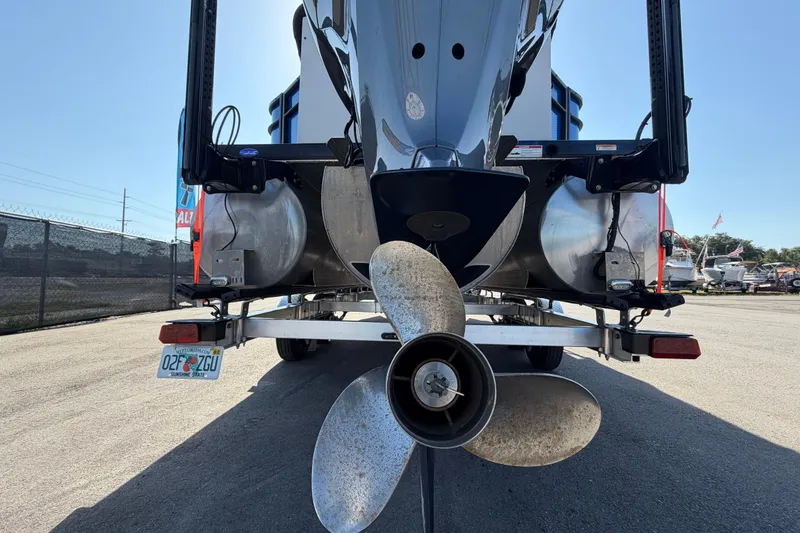 Slide: The Image of Rear view of 2022 Godfrey Sweetwater 2286FS boat with visible propeller and trailer. - 3