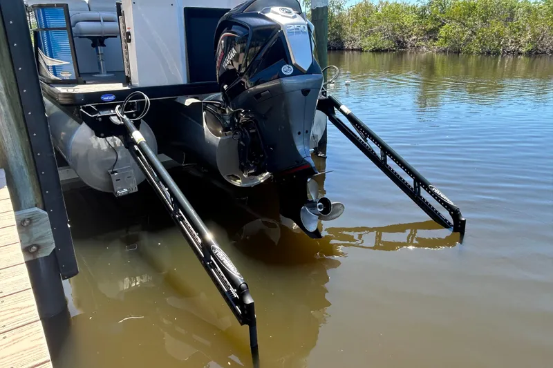 Slide: The Image of 2022 Godfrey Sweetwater 2286FS pontoon boat with Yamaha outboard motor in calm water. - 10