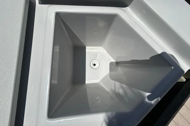 Slide: The Image of White sink on a 2022 Godfrey Sweetwater 2286FS boat, featuring a clean, angular design. - 100