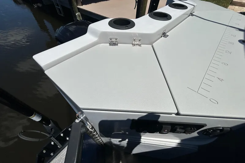 Slide: The Image of Fishing station on 2022 Godfrey Sweetwater 2286FS pontoon boat with rod holders and measuring scale. - 104