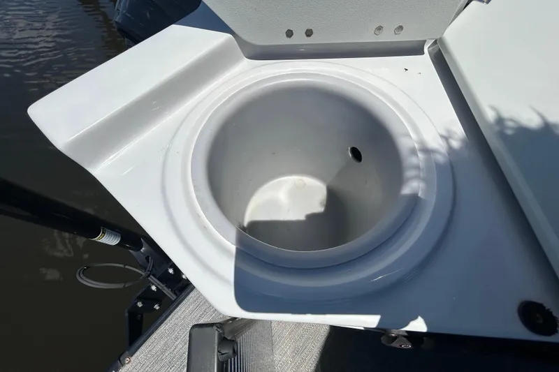 Slide: The Image of Livewell on 2022 Godfrey Sweetwater 2286FS boat, open lid, near water. - 106