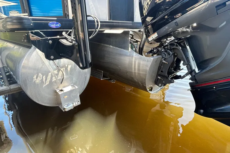 Slide: The Image of 2022 Godfrey Sweetwater 2286FS pontoon boat with outboard motor in water. - 13