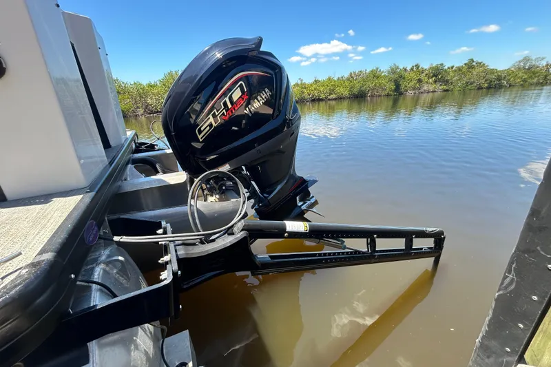 Slide: The Image of 2022 Godfrey Sweetwater 2286FS boat with Yamaha outboard motor on calm water. - 15