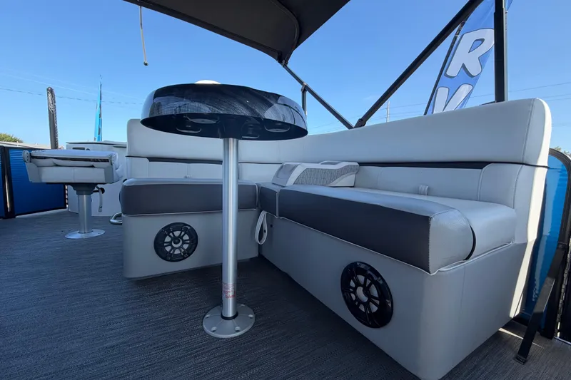Slide: The Image of 2022 Godfrey Sweetwater 2286FS boat interior with cushioned seating and modern design. - 37