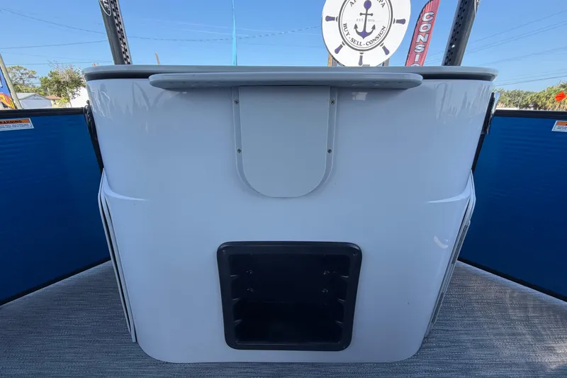 Slide: The Image of 2022 Godfrey Sweetwater 2286FS boat console with storage compartment and nautical decor. - 52