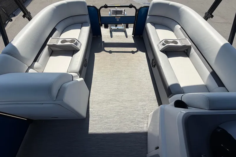 Slide: The Image of Interior of 2022 Godfrey Sweetwater 2286FS pontoon boat with plush seating and cup holders. - 75