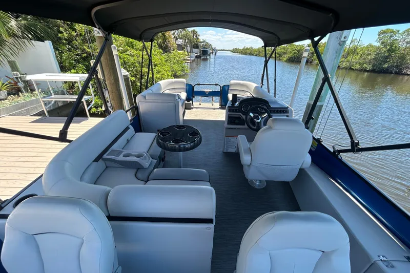 Slide: The Image of Interior of 2022 Godfrey Sweetwater 2286FS pontoon boat on a scenic river. - 28