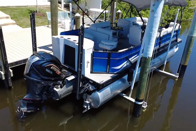 Slide: The Image of 2022 Godfrey Sweetwater 2286FS pontoon boat docked with Yamaha outboard motor. - 3