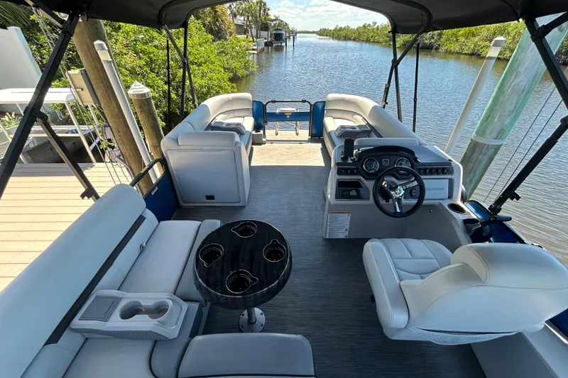 Slide: The Image of 2022 Godfrey Sweetwater 2286FS pontoon boat interior with seating and steering console. - 30