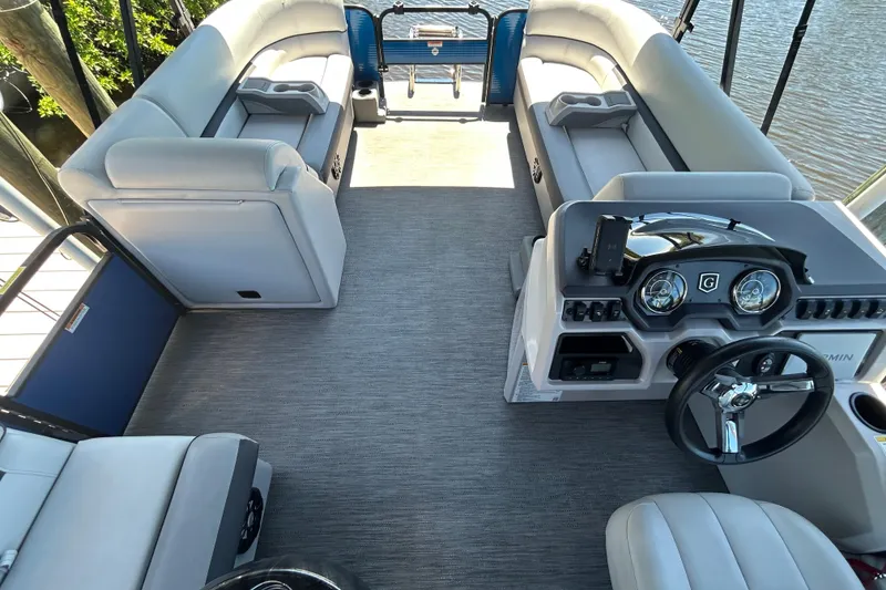 Slide: The Image of Interior of 2022 Godfrey Sweetwater 2286FS pontoon boat with plush seating and modern dashboard. - 31
