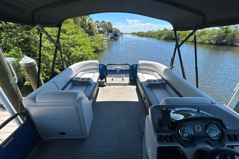 Slide: The Image of 2022 Godfrey Sweetwater 2286FS pontoon boat on a scenic river. - 32