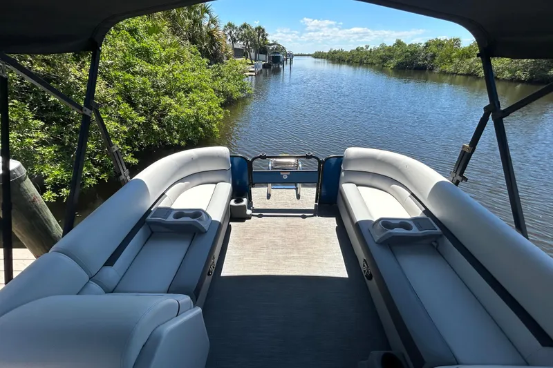 Slide: The Image of 2022 Godfrey Sweetwater 2286FS pontoon boat on a scenic river. - 34
