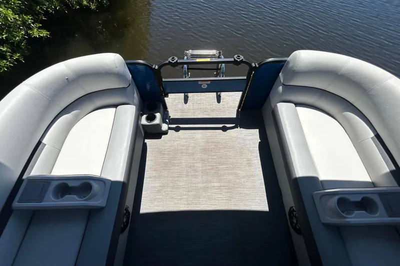 Slide: The Image of Interior view of 2022 Godfrey Sweetwater 2286FS pontoon boat with seating and cup holders. - 36