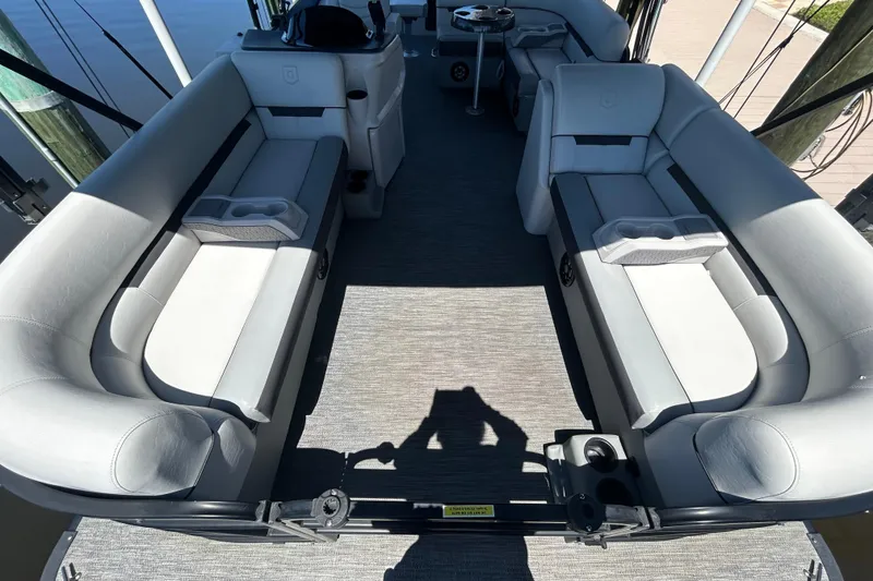 Slide: The Image of Interior of 2022 Godfrey Sweetwater 2286FS pontoon boat with gray seating and cup holders. - 38