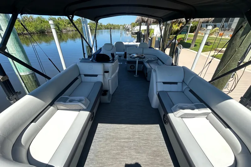 Slide: The Image of 2022 Godfrey Sweetwater 2286FS pontoon boat interior with spacious seating and sleek design. - 39