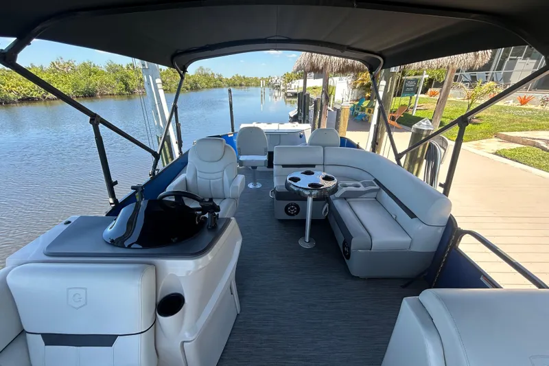 Slide: The Image of 2022 Godfrey Sweetwater 2286FS pontoon boat interior with seating and steering console. - 43